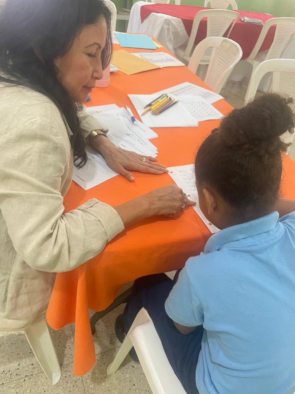 One-on-one reading assessment with a student in the D.R.